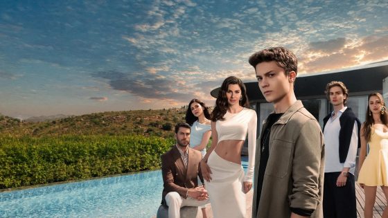 Six stylish young adults pose by a modern house and pool at sunset, with hills in the background.